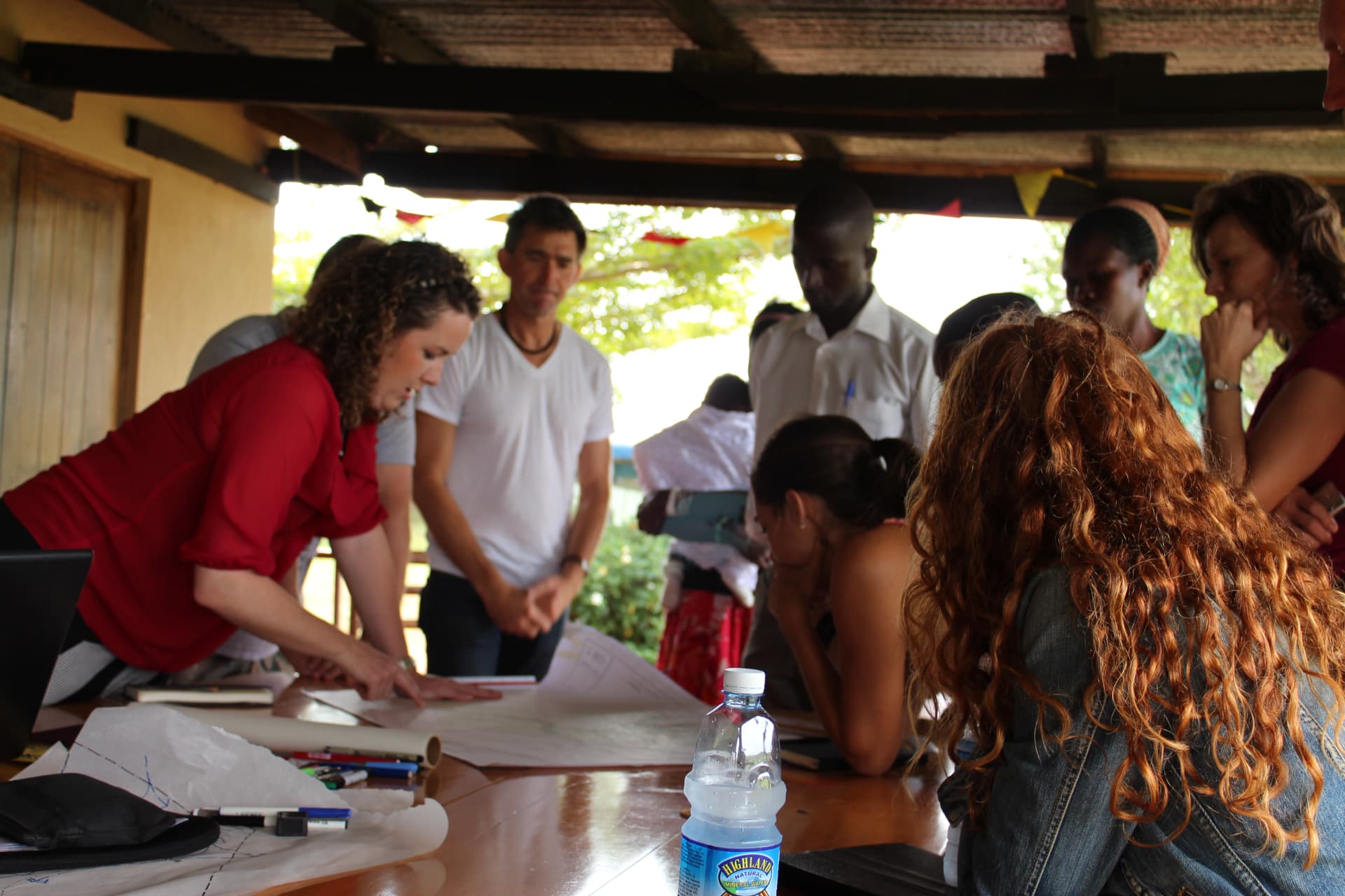 Monica working over plans with the design team